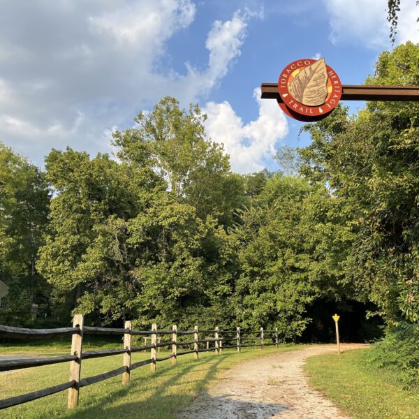 tobacco road sign over path