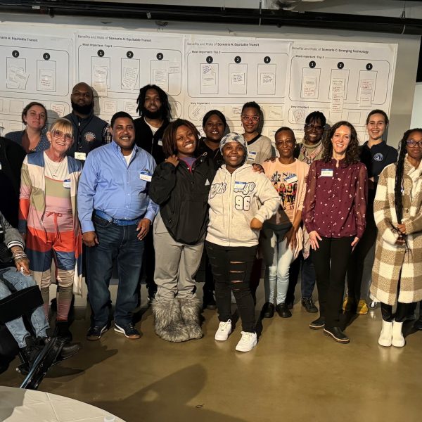 a group of people standing in a row