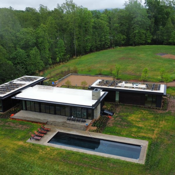 modern home in field aerial view