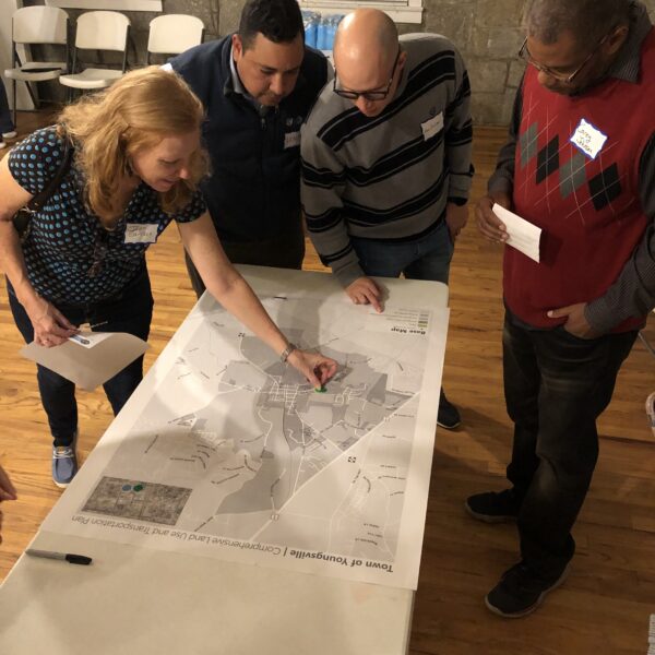 people standing around a table